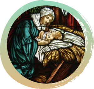Baby Jesus lying upon a bed of hay on a white cloth with Mary cradling him