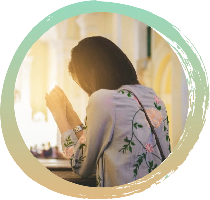 Circle cropped image of a woman praying