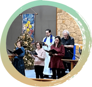 Five individuals standing in front of the alter with music sheets, singing. December 2024